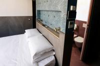 Posteľ alebo postele v izbe v ubytovaní Ottaviano Smart Rooms