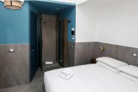 Posteľ alebo postele v izbe v ubytovaní Ottaviano Smart Rooms