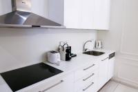 Kuchyňa alebo kuchynka v ubytovaní White & Gray Apartments