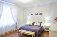 Posteľ alebo postele v izbe v ubytovaní White & Gray Apartments