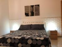 A bed or beds in a room at Casa Vacanze Kristel