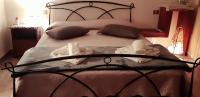A bed or beds in a room at La Vecchia Firenze