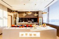 a kitchen with a counter with food on it at Crowne Plaza Vientiane by IHG in Vientiane