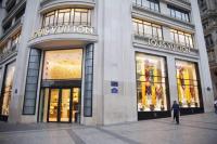 a man standing in front of a store at Champs Elysees Flat in Paris