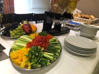 a plate of vegetables on a table with plates at Residence St Havel Prague Old Town in Prague