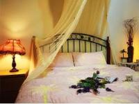 a bedroom with a bed with a flower arrangement on it at Yilan Affectivity in Wujie