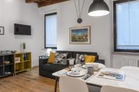 Televízia a/alebo spoločenská miestnosť v ubytovaní Flats4Rent Casa di Tea
