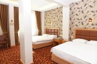 A bed or beds in a room at Hotel Grand Umit