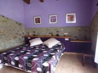 A bed or beds in a room at Can Mahola