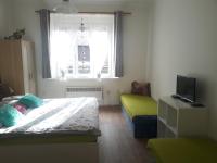 Postel nebo postele na pokoji v ubytování Apartmány Karlštejn