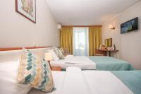 Postel nebo postele na pokoji v ubytování Hotel Laguna Garden