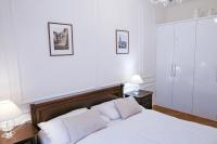 Posteľ alebo postele v izbe v ubytovaní White & Gray Apartments