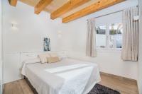 A bed or beds in a room at Beachfront Villa Es Clot by Sealand Villas