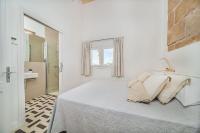 A bed or beds in a room at Beachfront Villa Es Clot by Sealand Villas