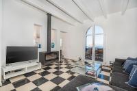 A television and/or entertainment centre at Beachfront Villa Es Clot by Sealand Villas