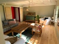 a living room with a couch and a table at La Motte in Louroux-de-Bouble