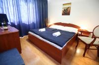 Postel nebo postele na pokoji v ubytování Hotel Nostalgia