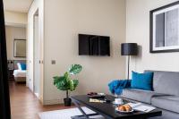 TV a/nebo společenská místnost v ubytování JOIVY Downtown Market Apartments