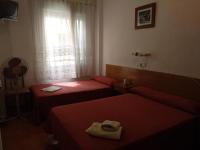 Postel nebo postele na pokoji v ubytování PENSION MIRAFLORES