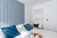 A bed or beds in a room at Apartamentos Pedregalejo Beach Playa