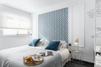 A bed or beds in a room at Apartamentos Pedregalejo Beach Playa