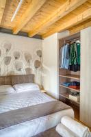 A bed or beds in a room at Ca' dei Battuti Apartments