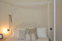 A bed or beds in a room at Ai due Mori Apt by Addler House Ospitality