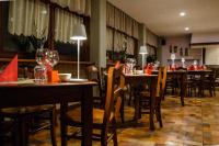 A restaurant or other place to eat at Al Fogolâr Rooms & Osteria with Saunaland