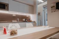 Kuchyňa alebo kuchynka v ubytovaní Kényelmes apartman a belváros szélén