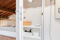 A bed or beds in a room at Modern Studio Flat - 3 mins from Duomo Square