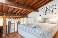 A bed or beds in a room at Modern Studio Flat - 3 mins from Duomo Square