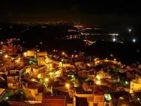 a view of a city at night with lights at TopHome 9 in Jiufen