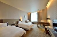 Shinkansen Grand Hotelにあるベッド
