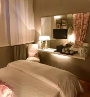 A bed or beds in a room at Capri Moon Guest House