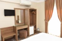 A bed or beds in a room at Hotel Grand Umit