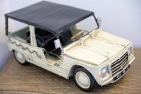 a small white toy car sitting on a table at Hôtel La Jetée in Saint-Martin-de-Ré