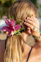 a woman with a flower in her hair at VIVE Hotel Waikiki in Honolulu