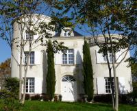 a large white house with trees in front of it at Château de la Comtesse in Saint-Martin-Petit