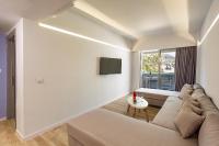 A television and/or entertainment centre at Akti Imperial Deluxe Resort & Spa Dolce by Wyndham