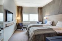 Postel nebo postele na pokoji v ubytování Quality Hotel Expo