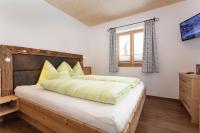 Cama ou camas em um quarto em Ferienhaus Widauer Herzoghof