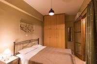 Posteľ alebo postele v izbe v ubytovaní Kamaraki-Apartments