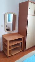 Televízia a/alebo spoločenská miestnosť v ubytovaní Apartments Slavica