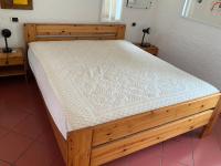 A bed or beds in a room at Ferienhaus Panorama, San Teodoro, Isuledda