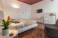 Televízia a/alebo spoločenská miestnosť v ubytovaní Bella Vista Rooms