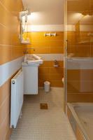 a bathroom with a sink and a shower at So&sol boutique Hotel, Tuzla in Tuzla