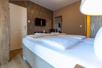 a bedroom with a large white bed in a room at So&sol boutique Hotel, Tuzla in Tuzla