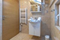 a bathroom with a sink and a shower at So&sol boutique Hotel, Tuzla in Tuzla