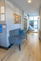 a living room with a blue couch in a room at So&sol boutique Hotel, Tuzla in Tuzla