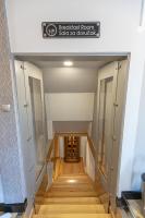 a stairway with a sign that reads breakfast room safe corridor at So&sol boutique Hotel, Tuzla in Tuzla